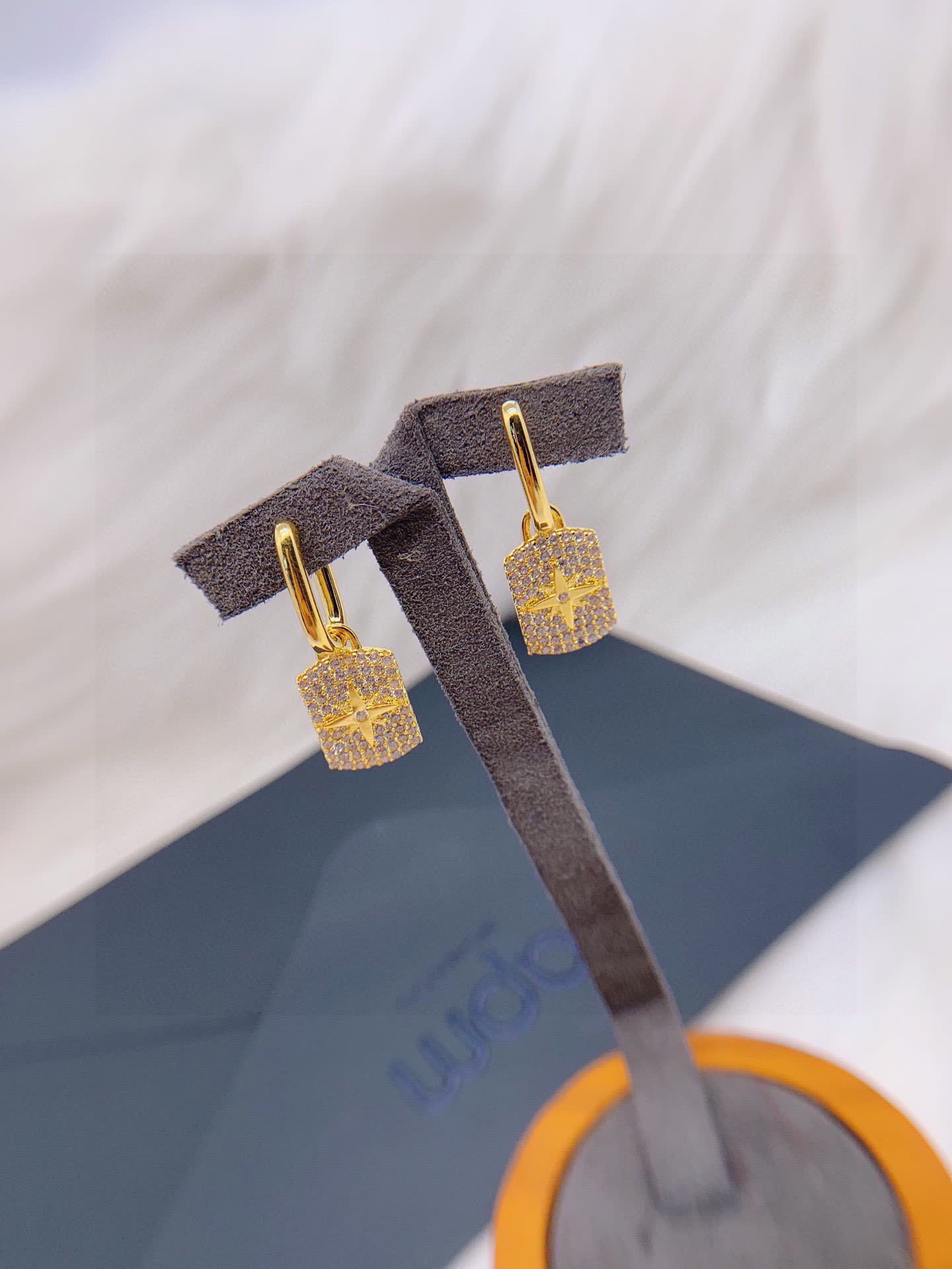APM Monaco Elegant Gold and Diamond Star Earrings